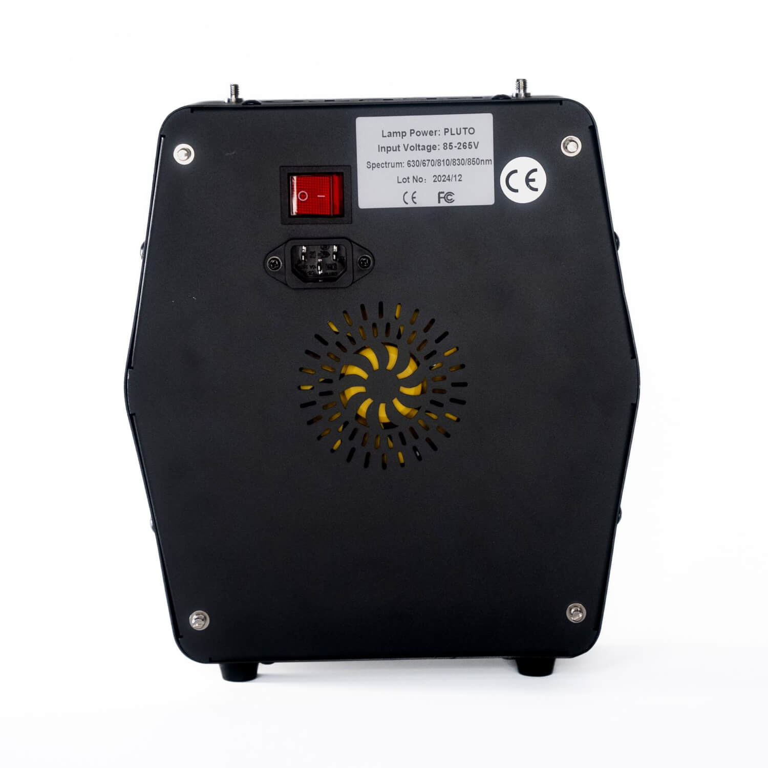 Back view of a black electronic device showing a red power switch, a 3-prong inlet, a white label with specs, and a circular yellow vent fan behind perforated slots