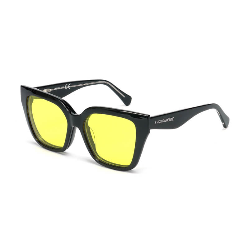 new_gialli_rainbow_mariposa_occhiali_blue_blocker_red-therap Black square-frame sunglasses with yellow lenses and brand visible on the arm.