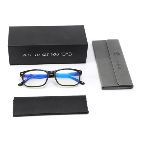 Flat lay of black eyeglasses with blue-tinted lenses beside a black box that reads 'Nice to see you' and a glasses icon, plus a gray case and cleaning cloth.